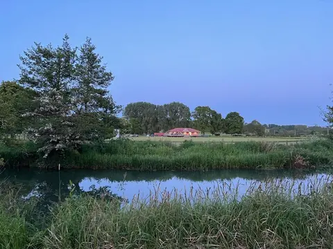 The River Cherwell at dusk under a clear sky